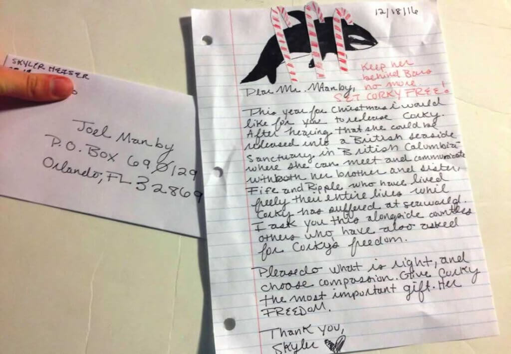 A handwritten letter with a picture of a whale.